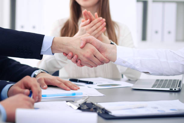 Close up of two business man shaking hands to each other finishing up the meeting.